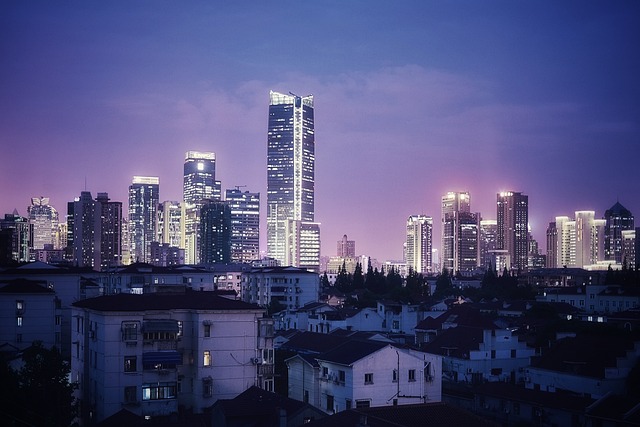 Shanghai skyline at dusk, with modern skyscrapers illuminated against the evening sky, symbolizing China's rapid urban and energy growth.